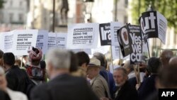 Demonstrators protest outside U.K. Prime Minister Gordon Brown's office at 10 Downing Street in central London.