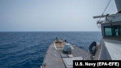 FILE - The Arleigh Burke-class guided-missile destroyer USS Bainbridge (DDG 96) sails in the Gulf of Oman, June 20, 2019