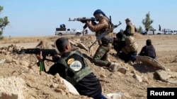 Tribal fighters take part in an intense engagement with Islamic State militants in Iraq's Anbar Province. (file photo)