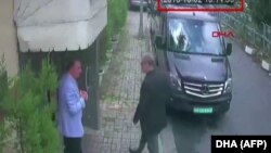 TURKEY -- A video grab made from CCTV footage shows Saudi journalist Jamal Khashoggi (R) arriving at the Saudi Arabian consulate in Istanbul on October 2, 2018