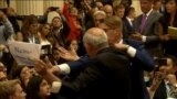 GRAB-Man Bundled Away From Trump-Putin Briefing