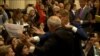 GRAB-Man Bundled Away From Trump-Putin Briefing