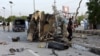 Pakistani security officials inspect a police truck after a bomb blast in in Quetta on April 24. 