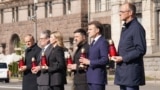 From left: Polish Prime Minister Donald Tusk, UK Prime Minister Keir Starmer, Ukrainian first lady Olena Zelenska, Ukrainian President Volodymyr Zelenskyy, French President Emmanuel Macron, and German Chancellor Friedrich Merz pay their respects to the victims of war at the Memorial for the Fallen in Kyiv on May 10, 