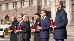 From left: Polish Prime Minister Donald Tusk, UK Prime Minister Keir Starmer, Ukrainian first lady Olena Zelenska, Ukrainian President Volodymyr Zelenskyy, French President Emmanuel Macron, and German Chancellor Friedrich Merz pay their respects to the victims of war at the Memorial for the Fallen in Kyiv on May 10, 