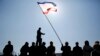 A man holds a Crimean flag during a pro-Russian rally on Lenin Square in Simferopol on March 15. (Reuters/Thomas Peter)