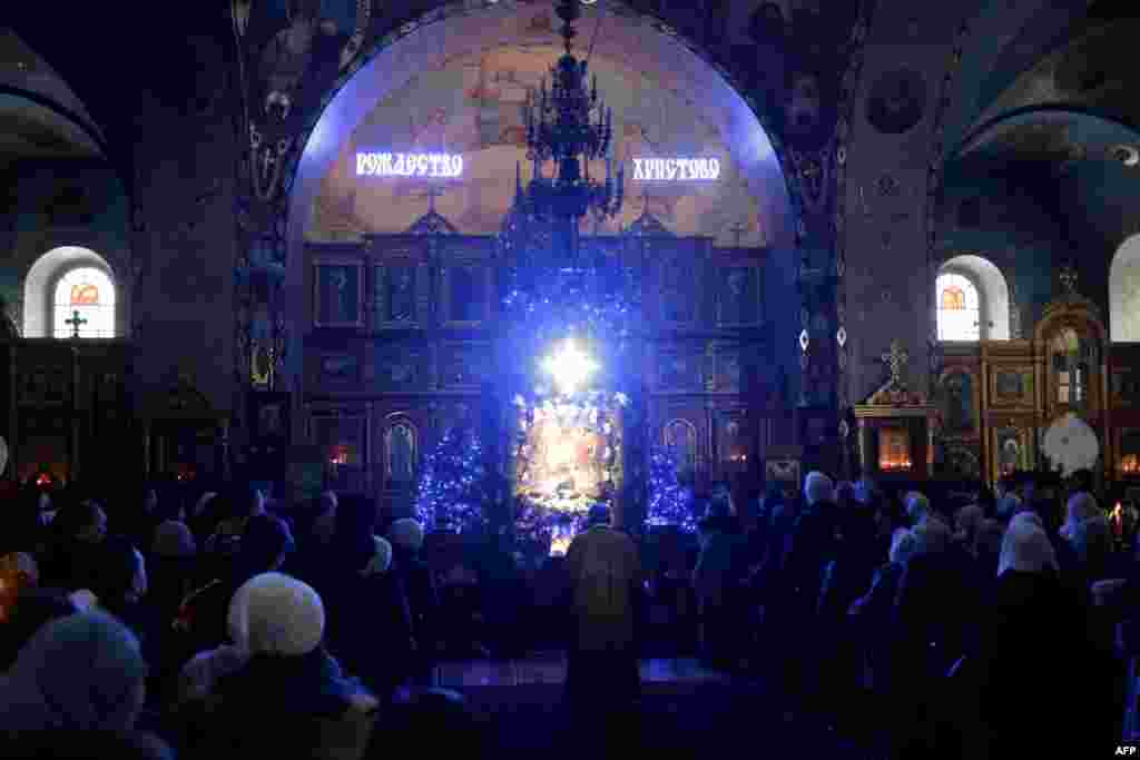 An Orthodox priest leads Christmas Eve Mass at the Aleksandr Nevsky Cathedral in the Crimean city of Simferopol.