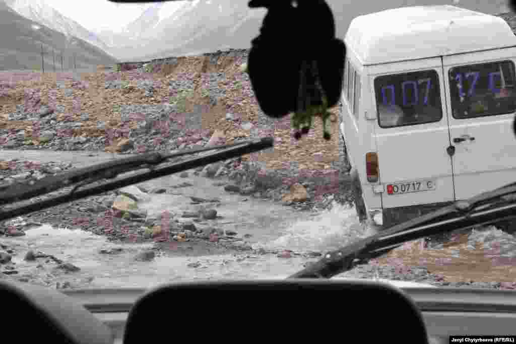 A minibus fords a stream on the rocky road between Kyrgyzstan and Murghob. The 420-kilometer road, built during the Soviet era, has been partly destroyed by landslides, making it passable only by four-wheel-drive vehicles. During winter, crucial food deliveries from Osh, Kyrgyzstan, slow almost to a stop.