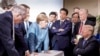 In this photo made available by the German Federal Government, German Chancellor Angela Merkel (center) speaks with U.S. President Donald Trump (seated) during the G7 summit in Quebec, Canada, on June 9. Trump angered allies by leaving the summit early and refusing to endorse a final communique that he had originally agreed to be a part of. (Jesco Denzel/German Federal Government via AP)