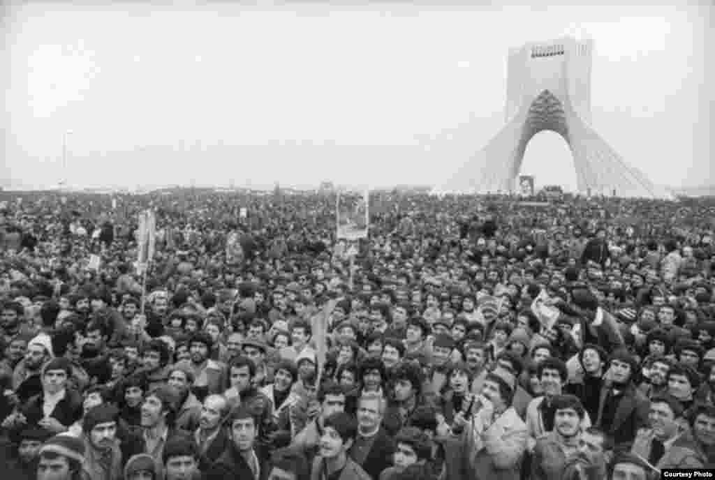 Some one million people gather in Freedom Square in Tehran as the Iranian Revolution begins in 1979.