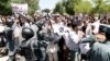 Afghan police clash with demonstrators during a protest in Kabul on June 2.