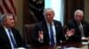 U.S. President Donald Trump, flanked by U.S. Senator Dick Durbin (D-IL) and Representative Steny Hoyer (D-MD), holds a bipartisan meeting with legislators on immigration reform at the White House in Washington, U.S. January 9, 2018