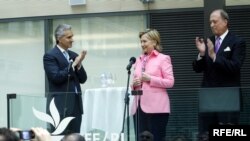 RFE/RL President Gedmin, BBG Governor Hirschberg, and staff applaud during Clinton's remarks at RFE/RL