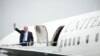 U.S. -- President Donald Trump waves while boarding Air Force One prior to departing Morristown Municipal Airport en route Camp David, Maryland, where he'll meet with his national security team to discuss a U.S. security strategy for South Asia that inclu