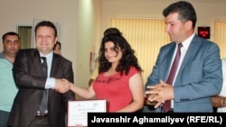 Azrbaijan -- Radio Azadliq reporter Durna Safarli receiving award for human trafficking coverage in Azerbaijan, 12Jun2012