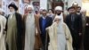 Ahmad Jannati, 92, walking with a stick among his peers. FILE PHOTO