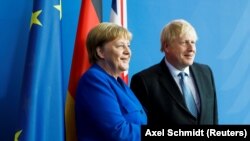  Boris Johnson, premijer Velike Britanije i Angela Merkel, kancelarka Njemačke 