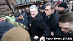 Former Ukrainian President Petro Poroshenko arrives at the State Bureau of Investigation for questioning as a witness in Kyiv on January 24.