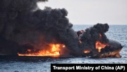 The burning Iranian oil tanker Sanchi is seen partially sunk in the East China Sea off the eastern coast of China on January 14.