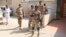 Pakistani rangers secure the school premises after unknown culprits threw a hand grenade at a school in Karachi
