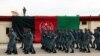 Afghan policemen march during a graduation ceremony in Helmand on February 6.