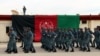 Afghan police officers march during a graduation ceremony.