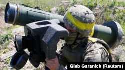 A Ukrainian soldier holds a U.S.-supplied Javelin anti-tank missile during a military exercise at near Rivne on May 26.