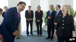 Georgian President Mikheil Saakashvili (left) and U.S. Secretary of State Hillary Clinton share a laugh prior to a meeting in Batumi on June 5.