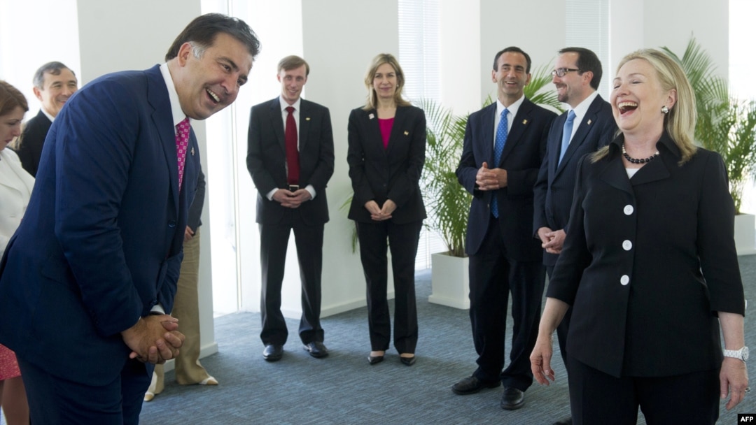 Georgian President Mikheil Saakashvili (left) and U.S. Secretary of State Hillary Clinton share a laugh prior to a meeting in Batumi on June 5.
