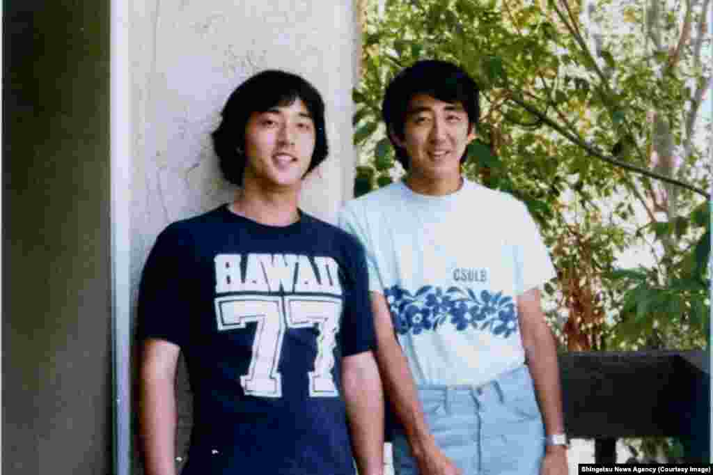 Japan's Prime Minister Shinzo Abe (right) during his time studying public policy at the University of Southern California
