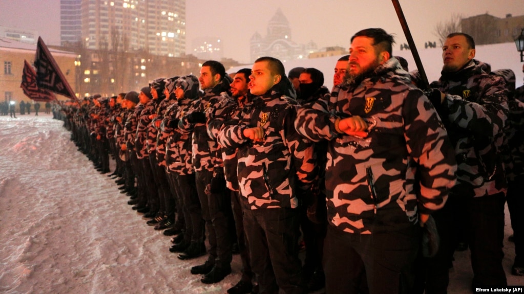 Volunteers of the right-wing paramilitary Azov Civil Corps swear an oath of allegiance in central Kyiv on January 28.