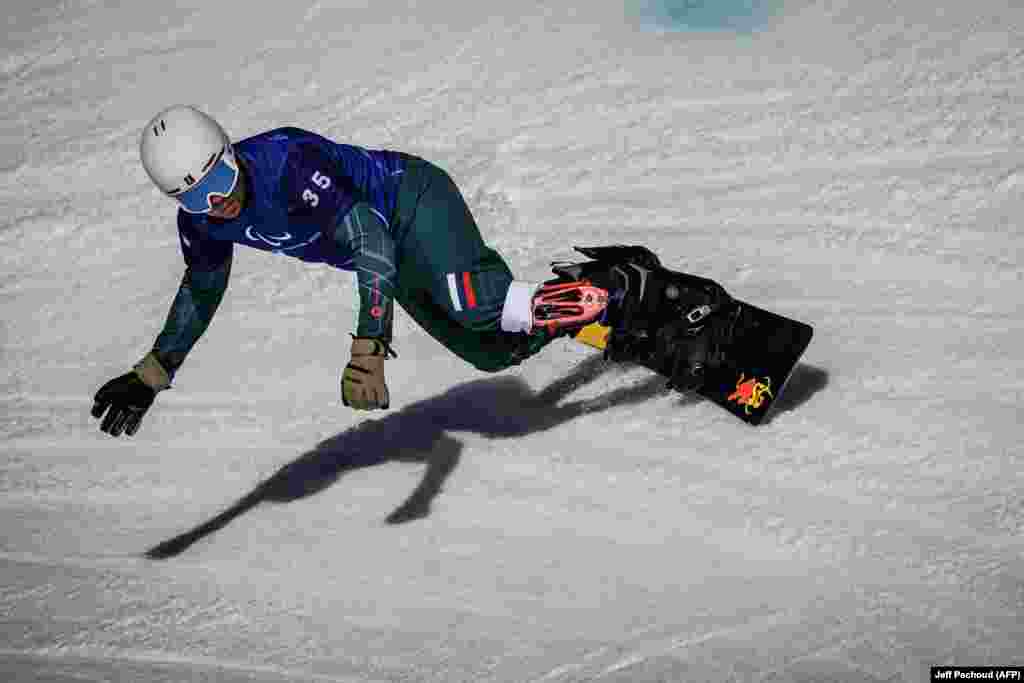 Russia's Dmitrii Fadeev competes in the snowboard cross event on March 8.A representative from the games' organizing committee responded to the Ukrainian statement, saying "we are supremely empathetic with the situation the Ukrainian people face right now but no matter how many Games the nation has competed at, that doesn’t give them a green light to break the rules."