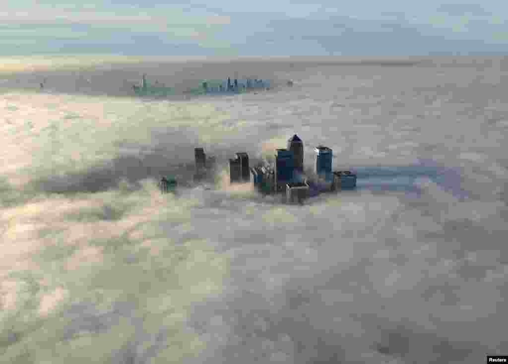 The Canary Wharf business district of east London seen during a foggy morning in a photograph received via the Metropolitan Police in London. (Reuters/Metropolitan Police@MPSintheSky/Handout via Reuters)