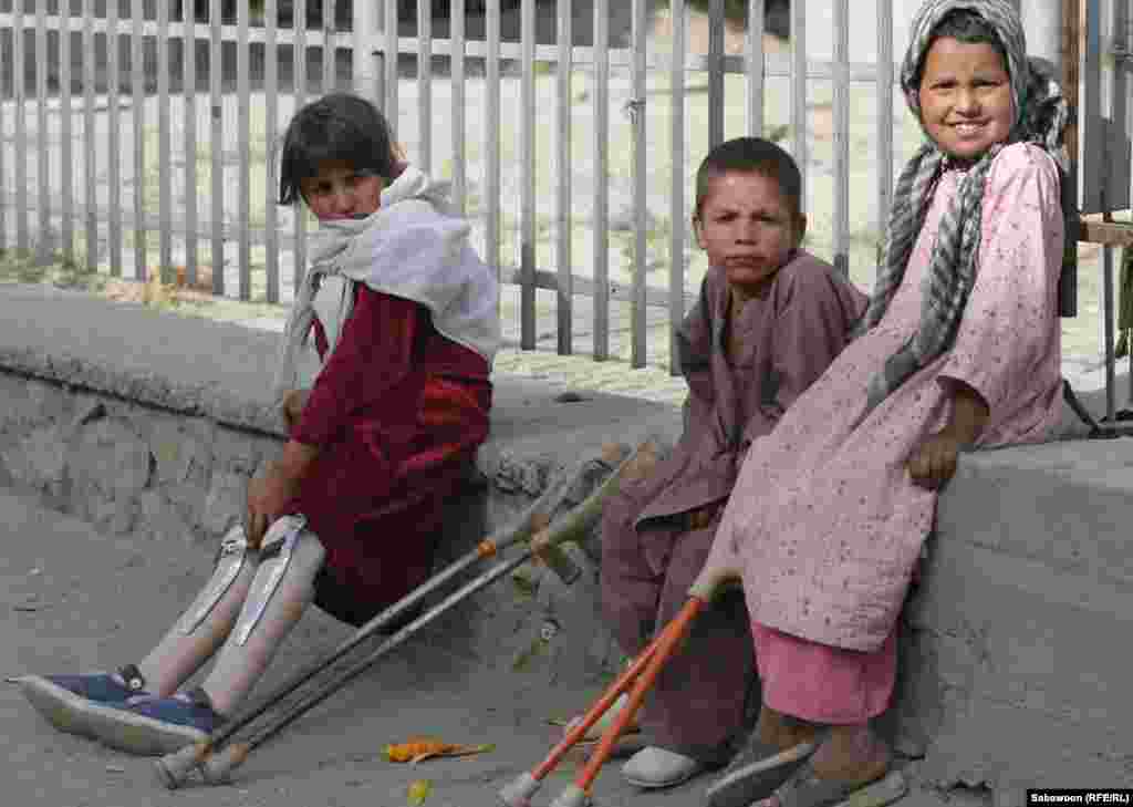 Disabled children beg on a Kabul street.