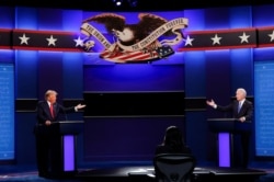 Дональд Трамп и Джо Байден во время второго тура предвыборных дебатов