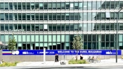 Poster "Bulgaria, welcome to the Euro" is seen in Brussels near the European comission