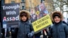 Сирійські діти на акції протесту в столиці Великої Британії проти режиму Башара аль-Асада в Сирії та режиму Володимира Путіна в Росії. На акції був плакат із зображенням двох «хімічних братів» Асада і Путіна. Лондон, 17 березня 2018 року