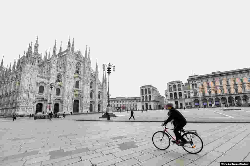 People are seen in Duomo square after a decree orders for the whole of Italy to be on lockdown in an unprecedented clampdown aimed at beating the coronavirus, in Milan, Italy, March 10, 2020. 