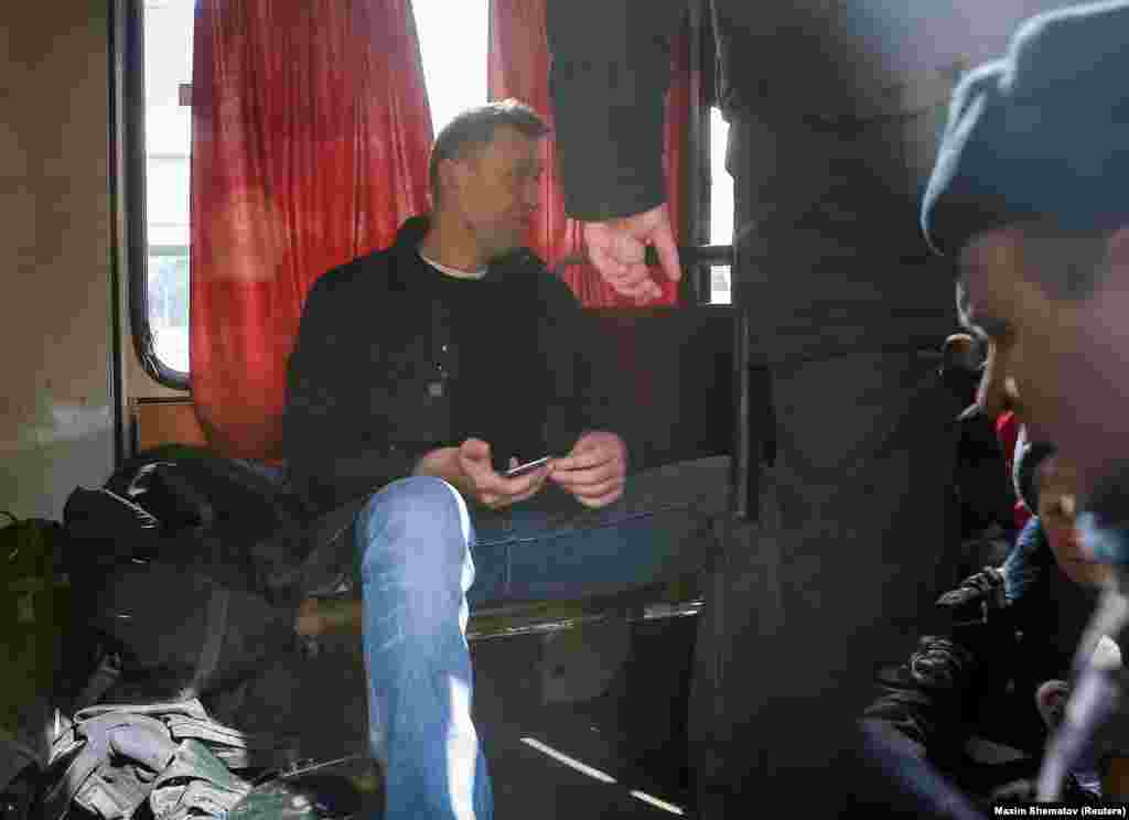 Navalny sitting in a police van after being seized by police during a massive Moscow rally in March 2017. He was fined $350 for taking part in what the authorities called an illegal protest.