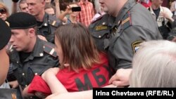 Police arrest activists at the rally in Moscow