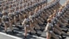 Iranian troops march on the 39th anniversary of the Iran-Iraq war before shrine to the late revolutionary founder Ayatollah Khomeini, just outside Tehran, Sunday, Sept. 22, 2019. FILE Photo