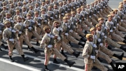 Iranian troops march on the 39th anniversary of the Iran-Iraq war before shrine to the late revolutionary founder Ayatollah Khomeini, just outside Tehran, Sunday, Sept. 22, 2019. FILE Photo