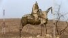 A statue destroyed by Islamic State militants is seen in the town of Bashiqa, after it was recaptured from Islamic State, east of Mosul, on November 10.