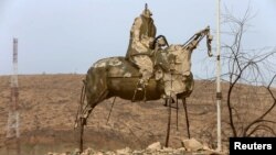 A statue destroyed by Islamic State militants is seen in the town of Bashiqa, after it was recaptured from Islamic State, east of Mosul, on November 10.