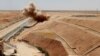 Syria -- Members of Kurdish Rojava Mine Control Organization destroy explosive devices planted by Islamic State militants near Ain Issa village north of Raqqa, June 20, 2017