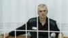 Russia -- Platon Lebedev, jailed business partner of Russian ex-tycoon Mikhail Khodorkovsky, looks out from the defendant's box during a court hearing to consider a request for parole in Velsk in Arkhangelsk Region, 27Jul2011