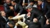 A scuffle breaks out in the Ukrainian parliament on October 6, 2017. The melee erupted over a law regarding Ukraine&#39;s state sovereignty in separatist-held territory in the east of the country.