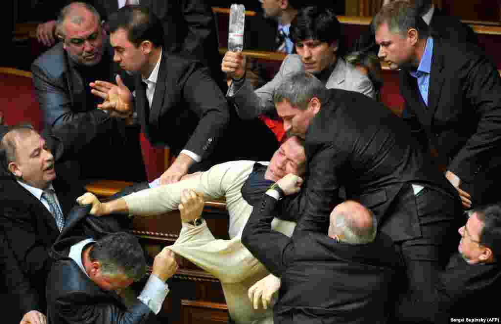 Punches, a headlock, and a weaponized water bottle during a brawl in Kyiv&#39;s parliament in April 2010. The fighting erupted over Ukraine&#39;s decision to extend Russia&#39;s lease of a naval base in Crimea.&nbsp;