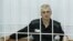 Russia -- Platon Lebedev, jailed business partner of Russian ex-tycoon Mikhail Khodorkovsky, looks out from the defendant's box during a court hearing to consider a request for parole in Velsk in Arkhangelsk Region, 27Jul2011