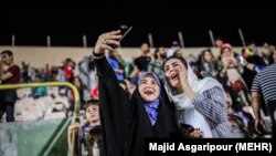 Iranian football fans in Iran watching Iran Spain game via screen